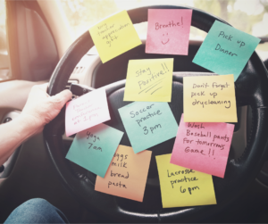 Facebook sized image of steering wheel with lots of sticky note reminders.