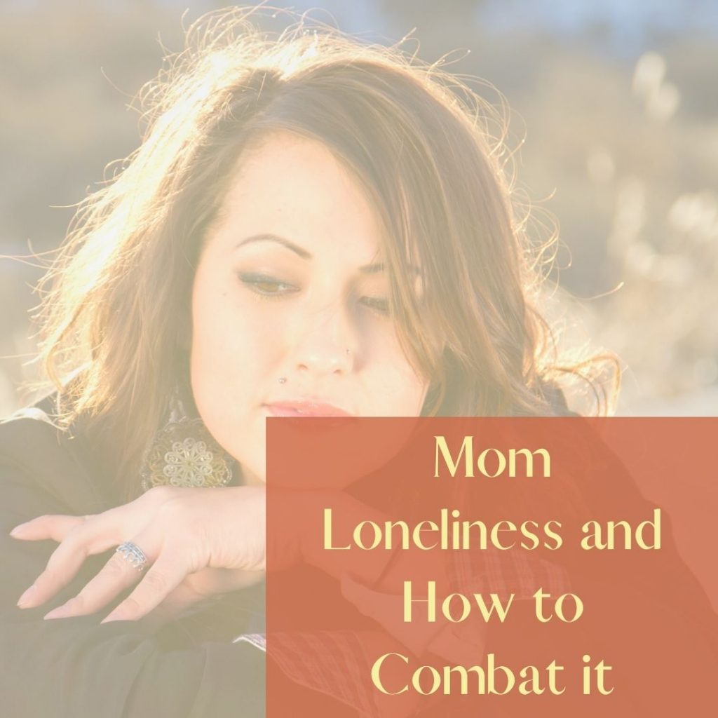 Mom loneliness feature image of sad woman with chin on her arms.
